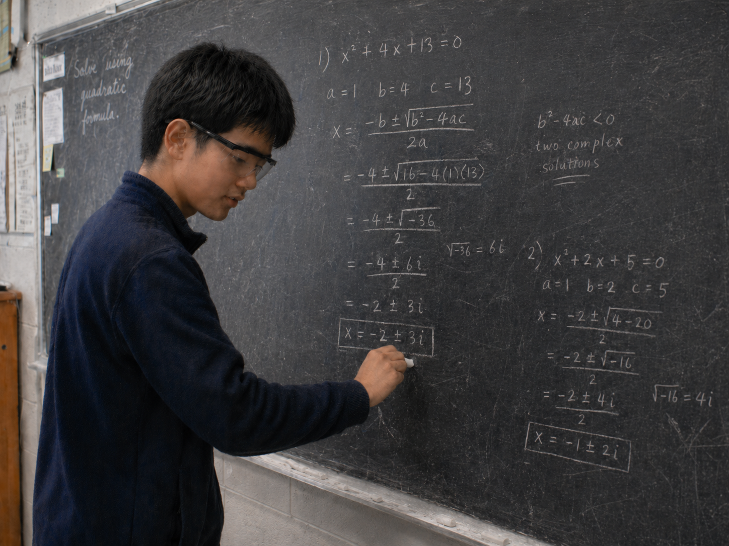 Student solving advanced math problems on a chalkboard
